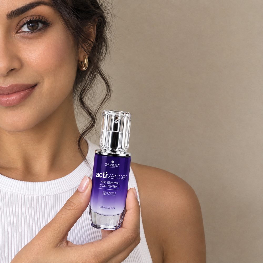 Woman holding Activance Age Renewal Concentrate